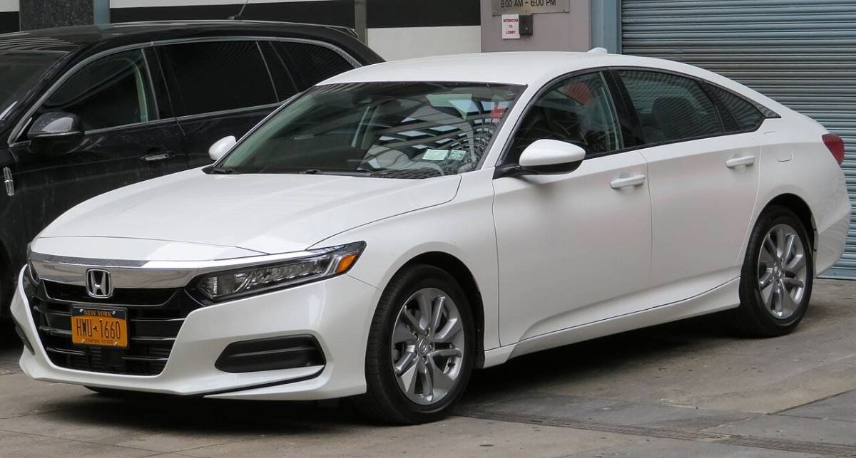 A white sedan parked outdoors